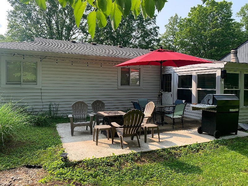 Patio has outdoor lighting and firepit