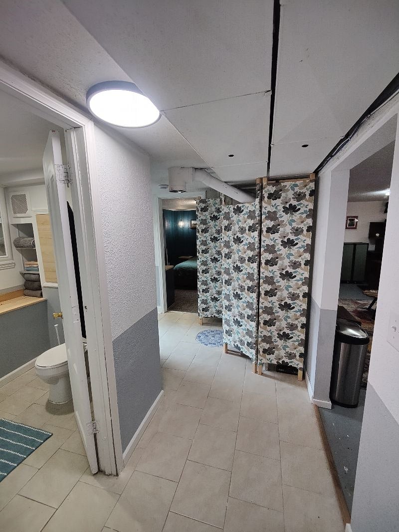 Hallway view showing the location of the bedroom, bathroom, living room, and kitchen