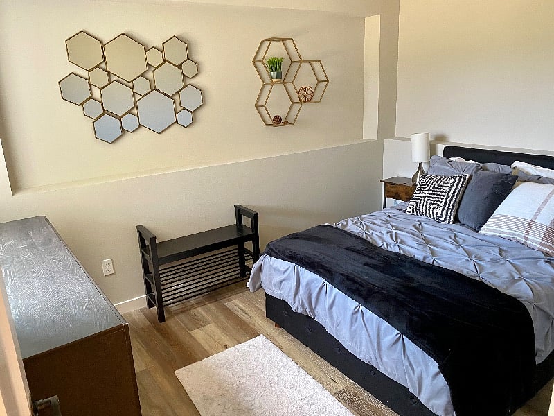 Full size bed with full dresser, rack. Note there is no closet, so its furnished to accommodate. There is a closet right outside the room.addl full size bed