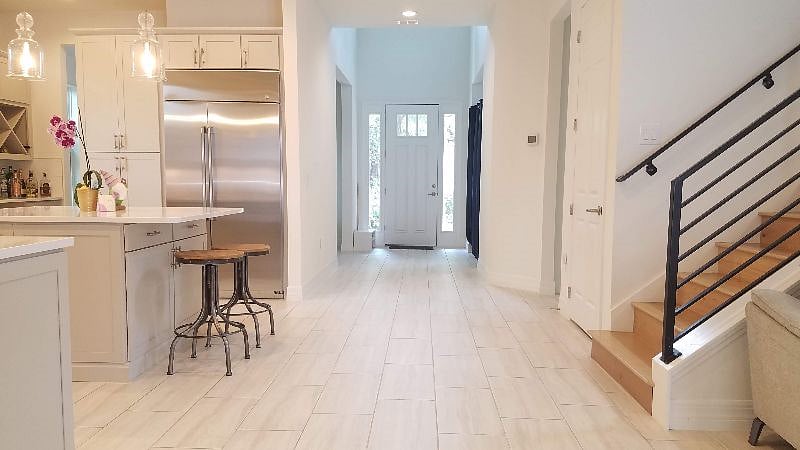 Left: Kitchen
Center: Front Entrance, Foyer, Entry Hallway 
Right: Stairwell to 2nd Floor
