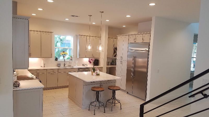Huge modern kitchen with lots of storage and countertop space perfect for cooking and baking -- with 2 ovens (one full size one small).