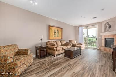 Spacious living room opens golf course views
