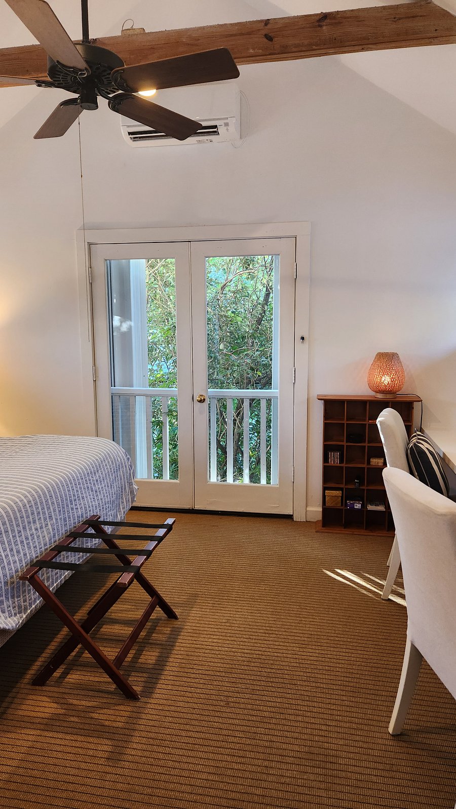 view toward french door balcony and tree tops