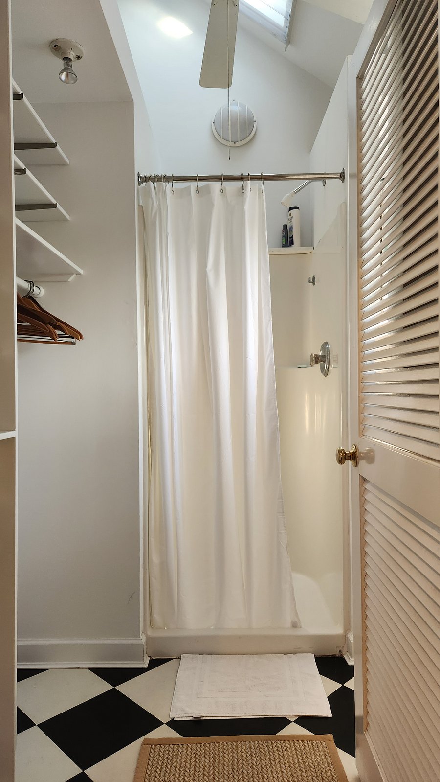 shower with skylight above