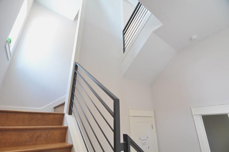 Modern Steel railings adorn the stairwell