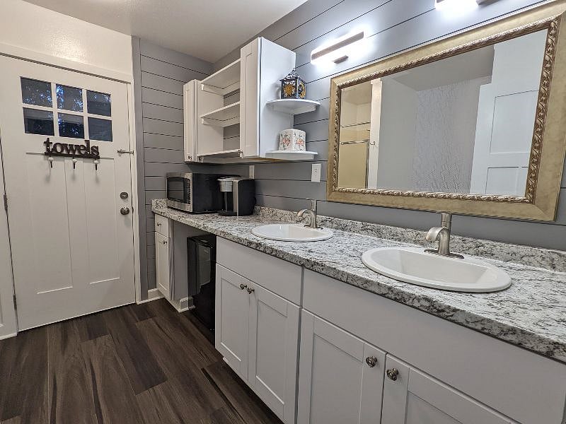 A bathroom, with towels and a shower, along with a brand-brand-new toilet.