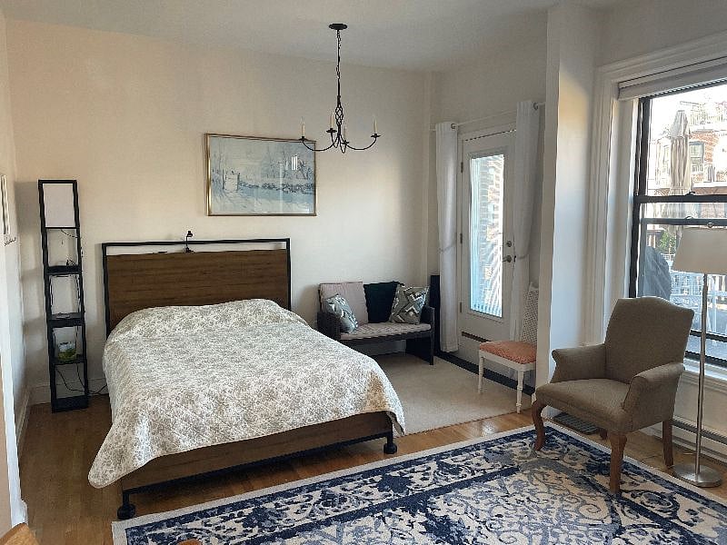 Large 12'x20' master bedroom with queen bed and spacious adjoining sitting area
