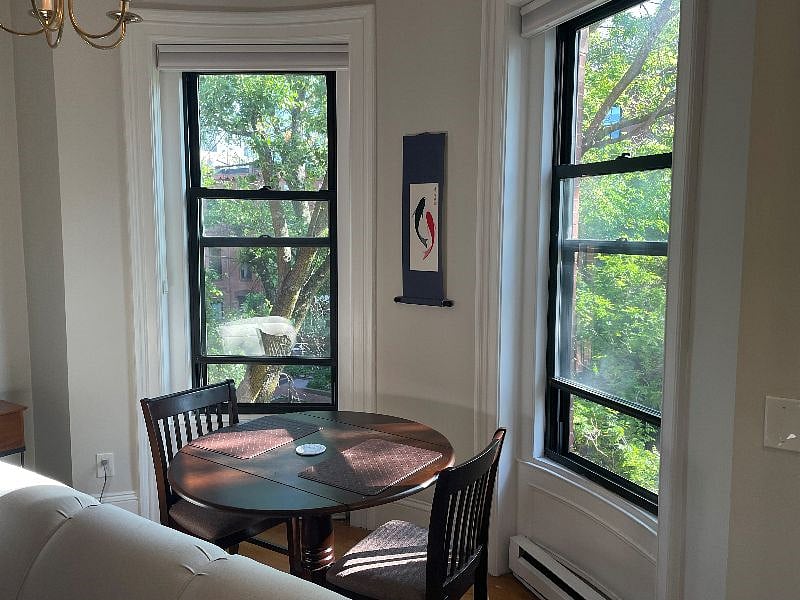 Dining area by large bay windows