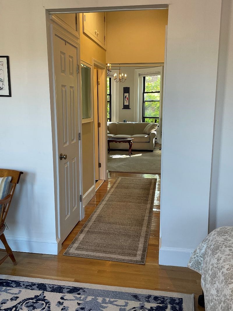 Hallway with washer/dryer closet