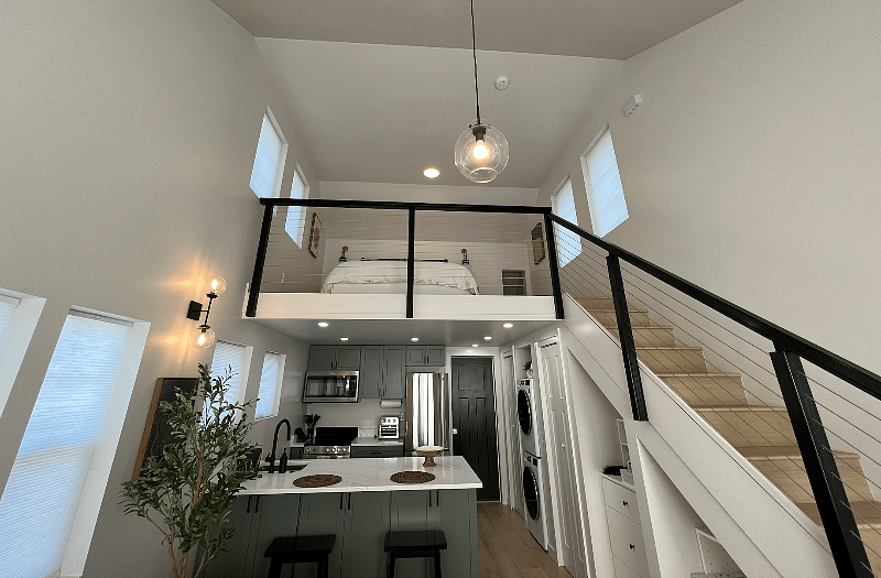 A full look at the upper level and tall ceilings taken from downstairs