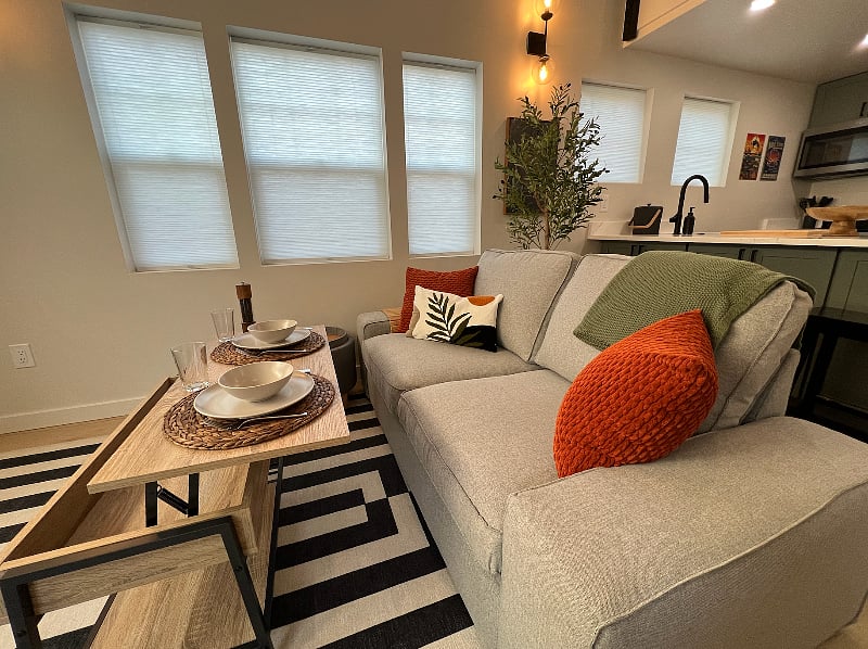 The coffee table raises to become a working or dining area
