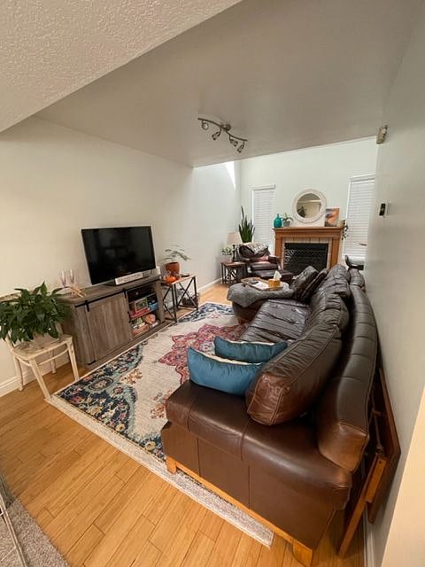 Shared living room with couch, TV, board games, and DVDs.