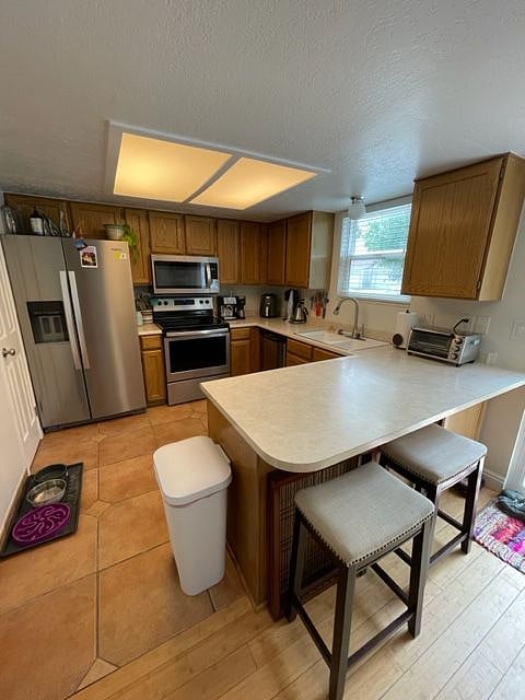 Shared kitchen space with barstools.