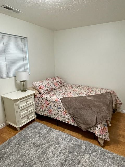Lamp, nightstand, rug, and Double bed
