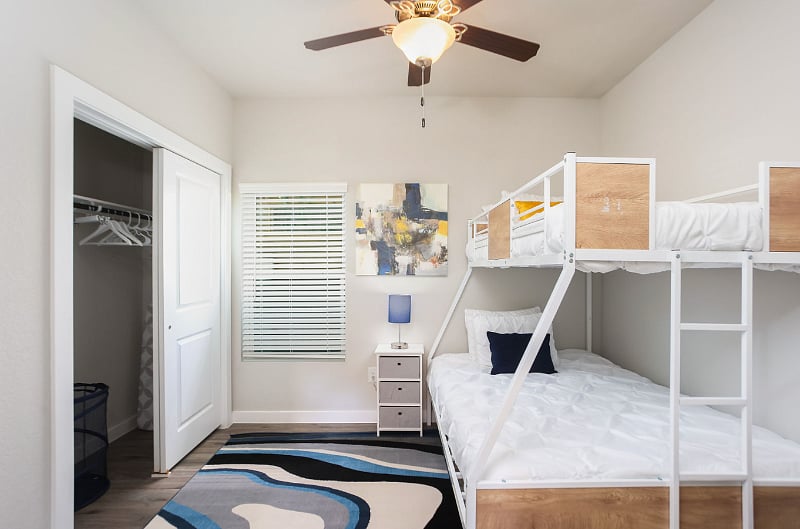 Alpha-1 BR Suite (1st Flr): Bunk bed (Bottom-Double/Top-Single) with plush clean linens, USB charging capability at bedside. Full-sized bathroom suite, with Hair dryer, Body soap, and Shampoo dispensers, luggage rack, laundry basket, iron, and hangers.