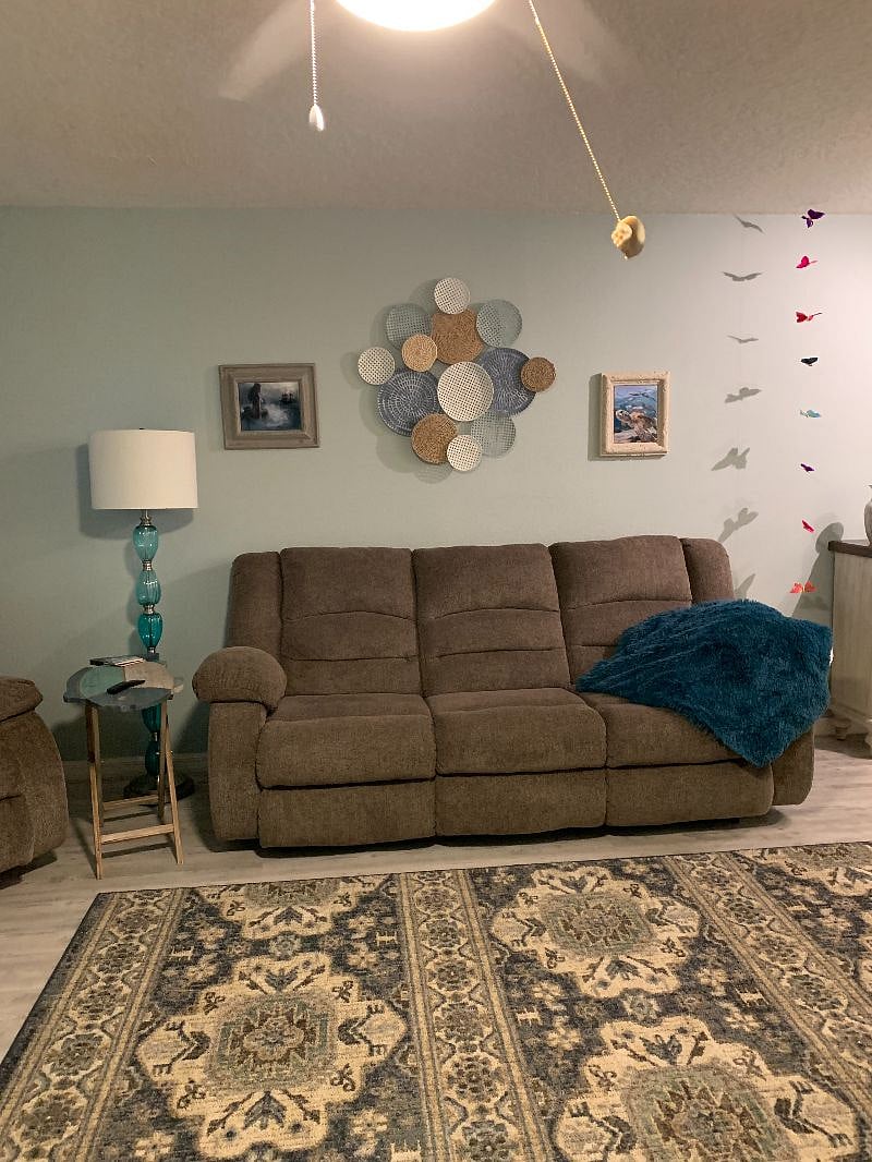 Sofa faces 75" Smart TV
