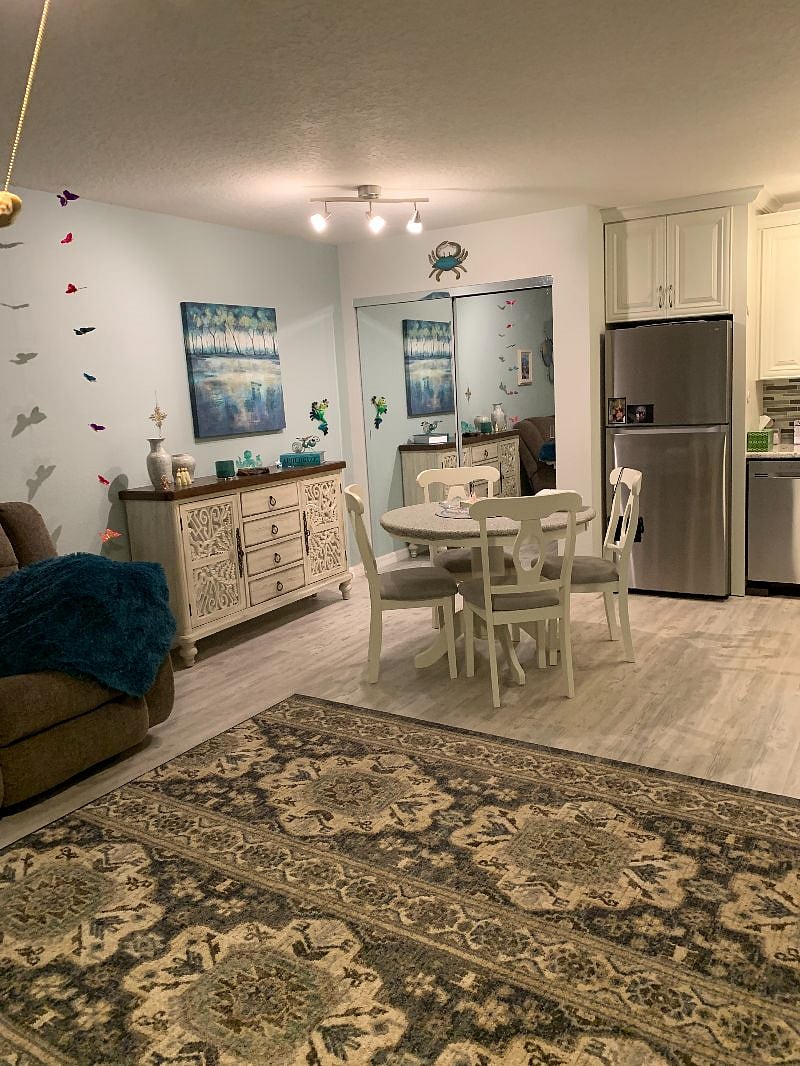 Dinette view - mirrored closet door houses Washer/Dryer & Microwave