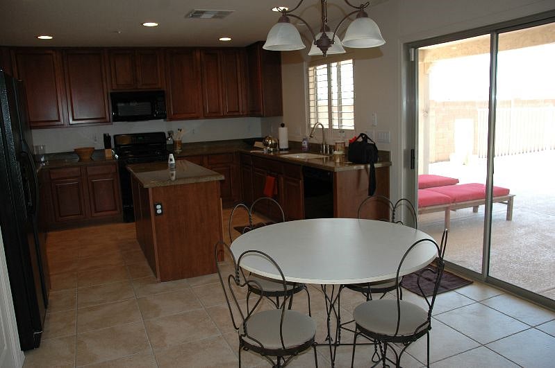 The kitchen walks right out onto the back patio for year-round outdoor living.