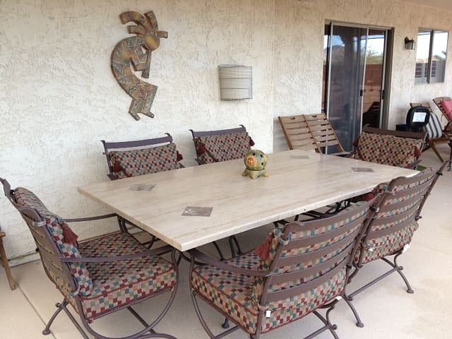 Dine out on the back patio on a gorgeous stone table.