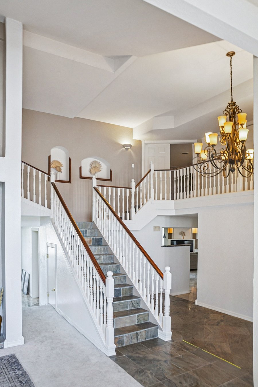 Staircase. Guest suite top of stairs to the left. Master suite through open doors to the right.