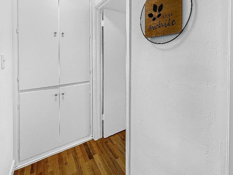Hallway with linen cabinets