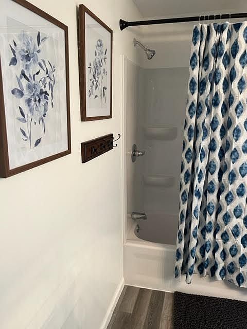 A bath tub and shower