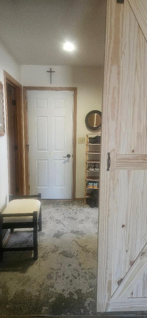 door to garage, from lower level bedroom
Shoe rack for your shoes
sliding barn door with lock