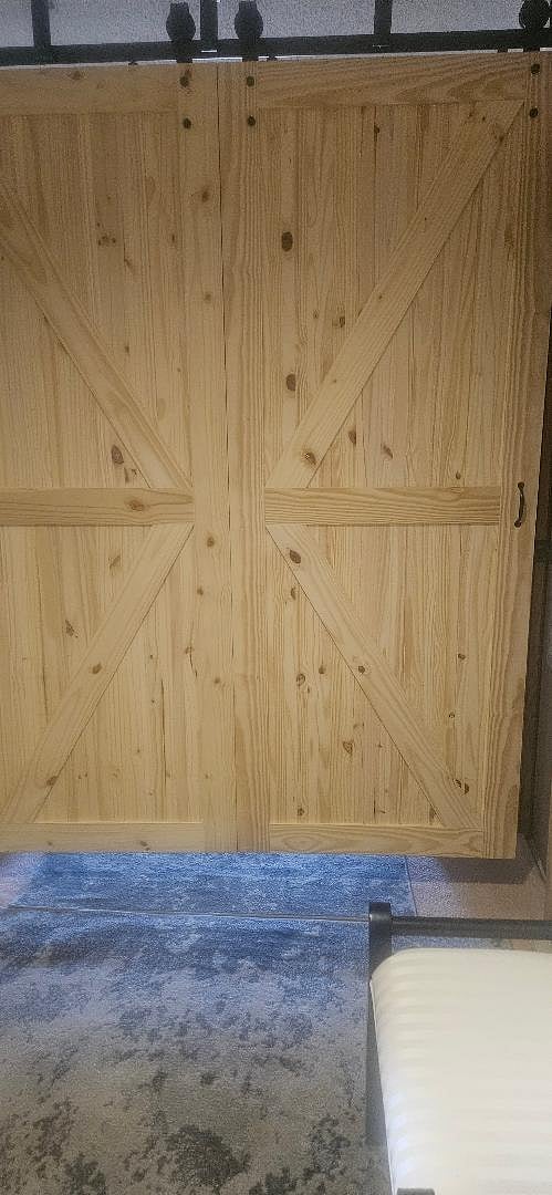 barn door with lock, lower level bedroom door