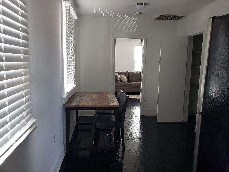 Apt. No. 1. Dining area of Kitchen with large pantry to right.