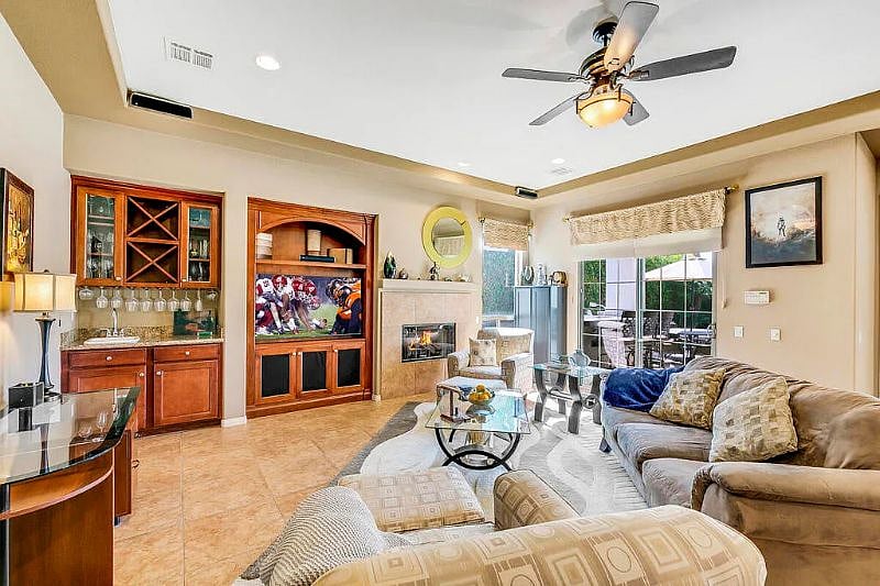 living room with TV and bar