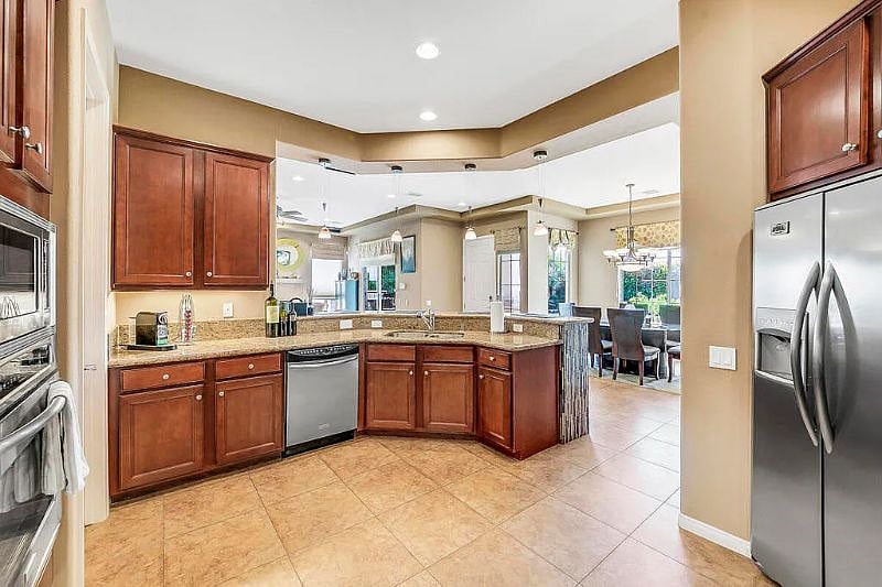 kitchen with dishwasher and bar