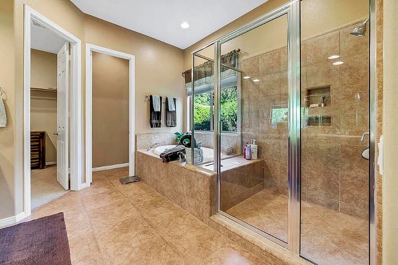 master bathroom with walk in closet