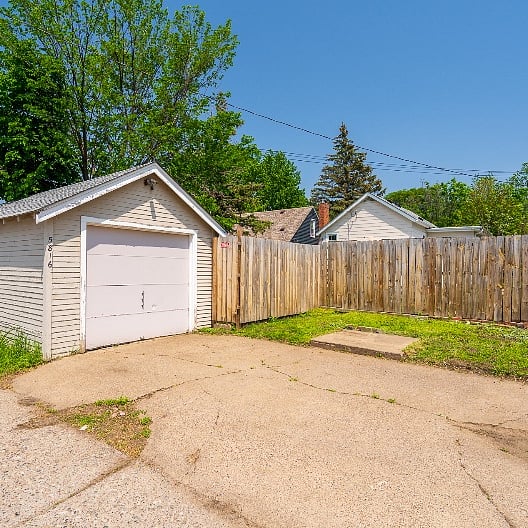 One car garage & driveway in alley