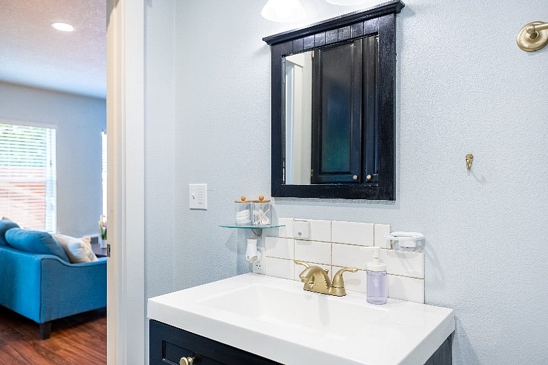 Bathroom sink and vanity. Bathroom has new black fixtures which have not been updated in pictures yet.