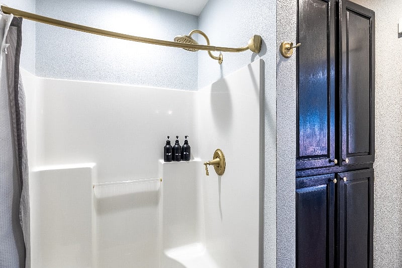 Bathroom shower that has new black fixtures, have not been updated in pictures yet.