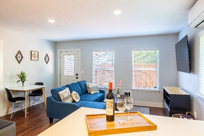 Living room, dining area, Samsung smart TV and pull out sectional sofa.