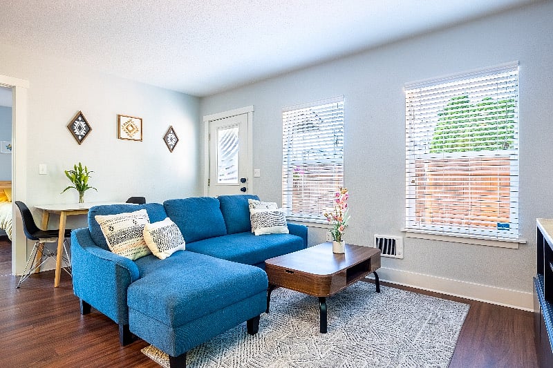 Sectional sofa and dining table behind.