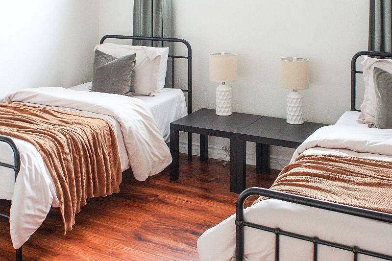 Double twin bed in guest room.