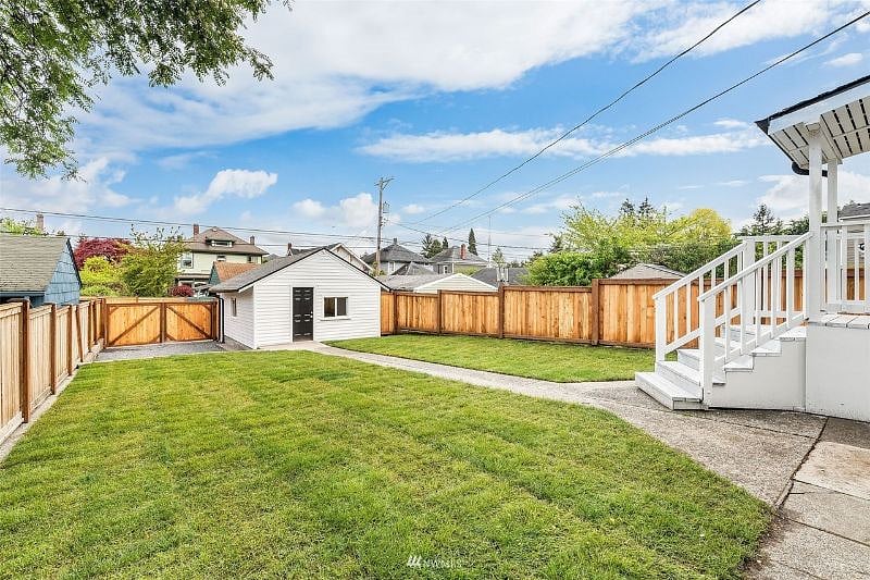Big shared backyard with small patio space (in lower right of photo)