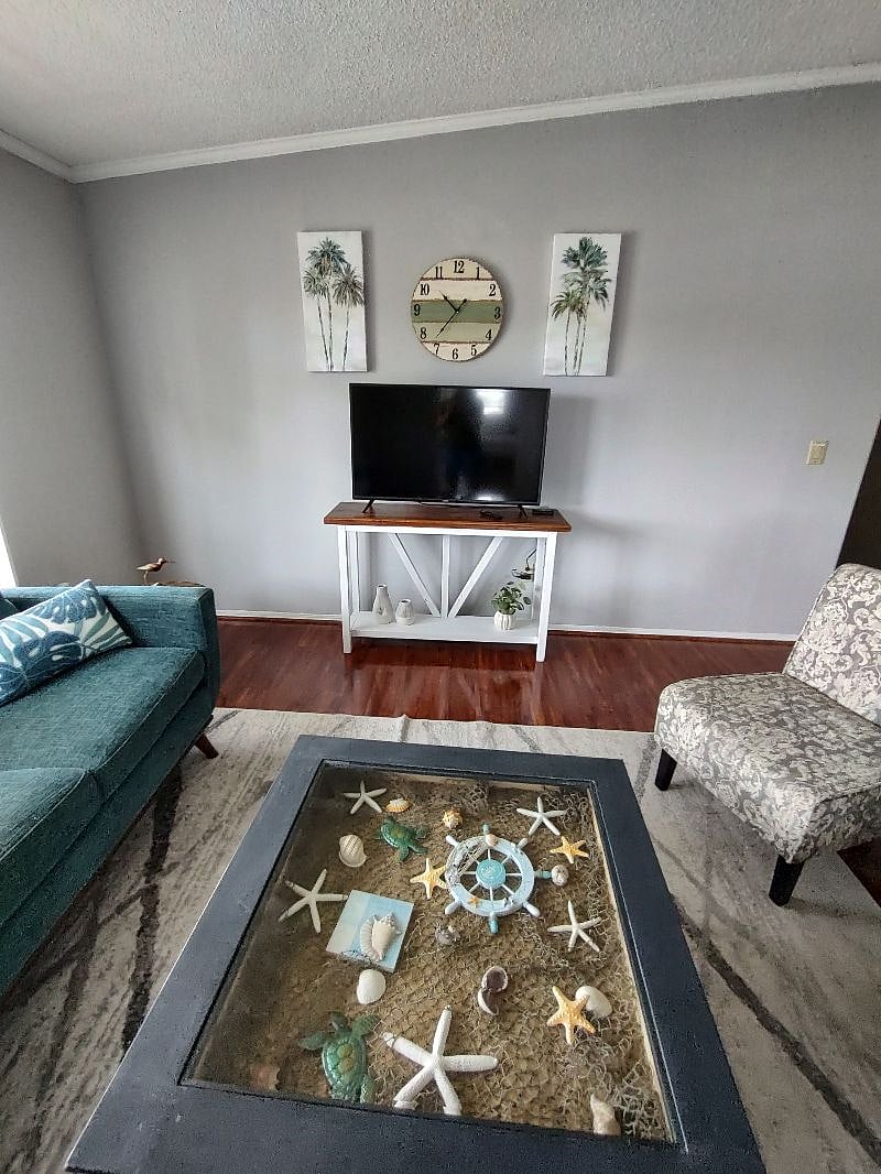 New larger TV and TV stand added