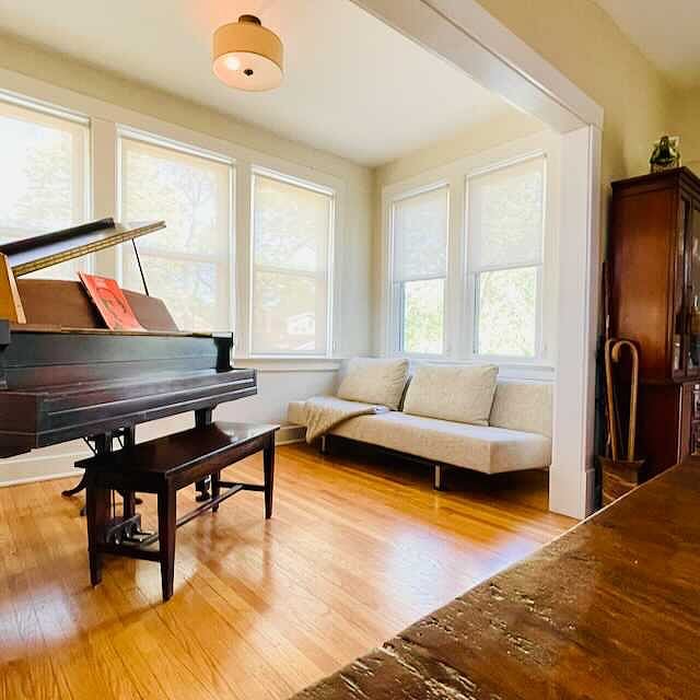 Piano / Sun Room with Bensen Modern Fold out Sleeper CouchBack Pi