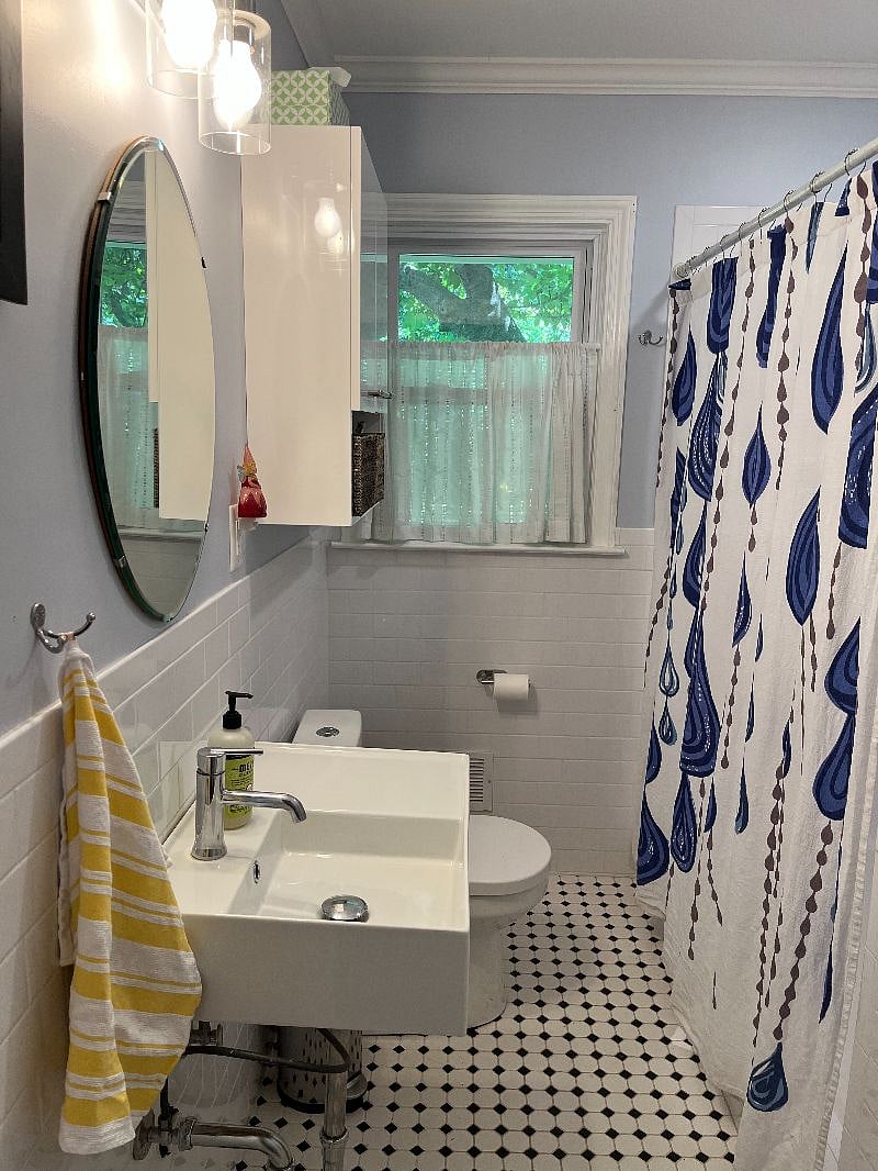 Full bathroom with tiled shower