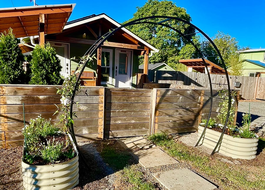 View of main house. Studio is to right of main house behind 6' fence with key code entry.