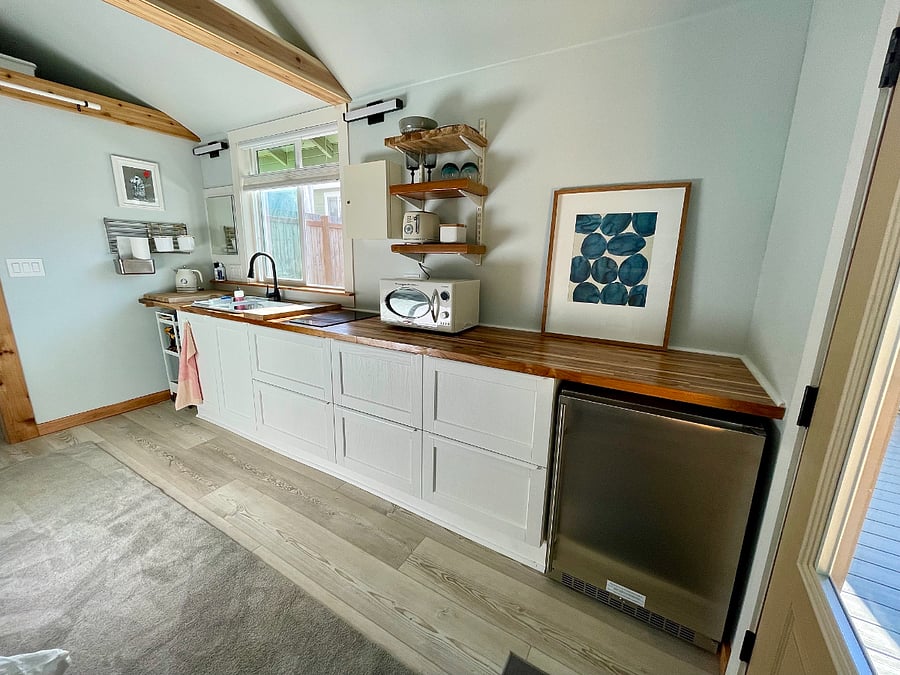 Early view of kitchen set up. Before t.v. was mounted to right side of wall.