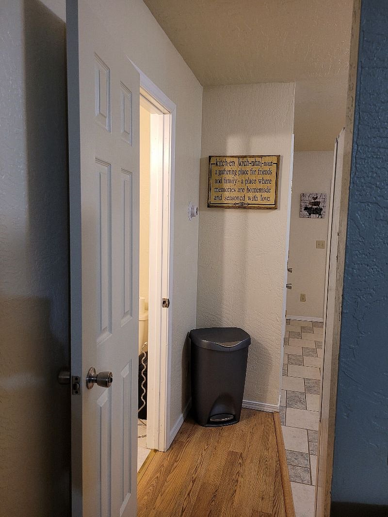 Half-bath to the left, kitchen to the right.