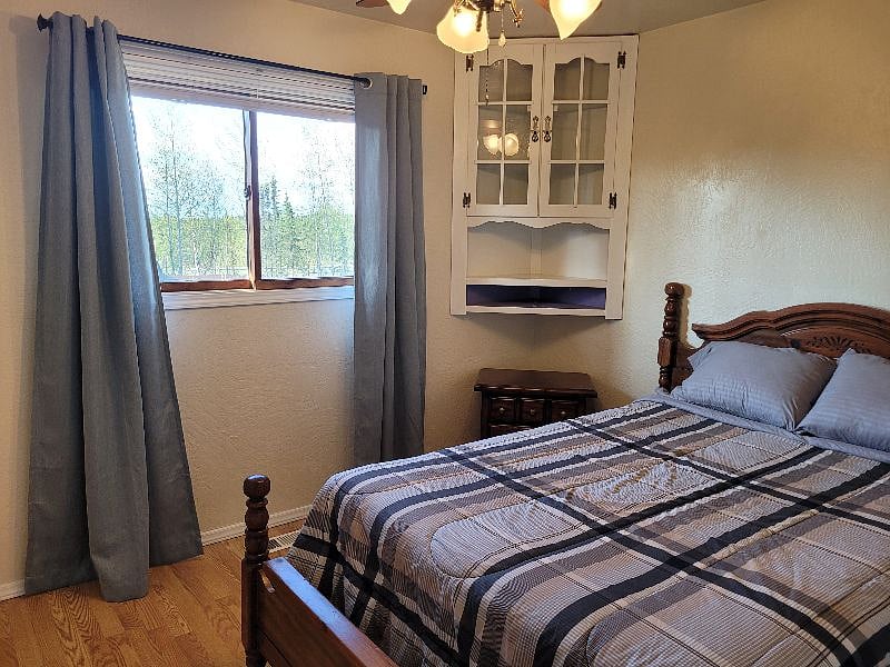 Back bedroom - double bed with backyard view.