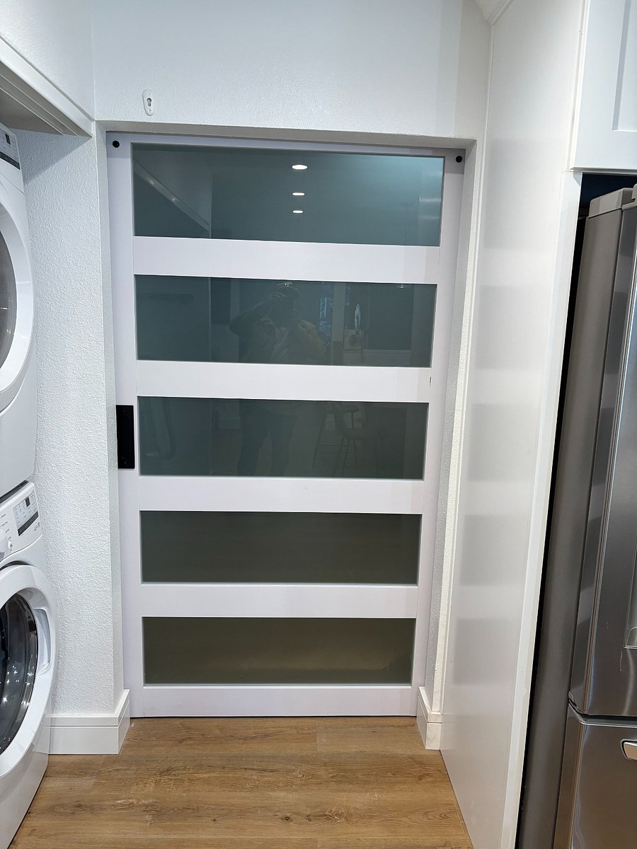 Door between the living space and the bedroom and bathroom. (Kitchen side view)