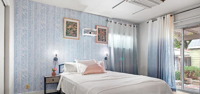 Main floor bedroom with projector TV