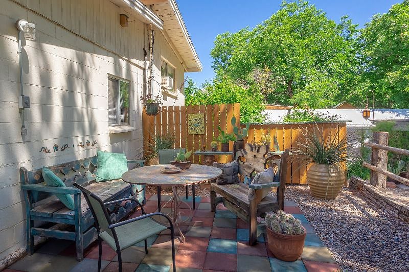 Another great view of the back patio/terrace. The back yard is fully enclosed so it's a perfect area for dogs to relax and play.