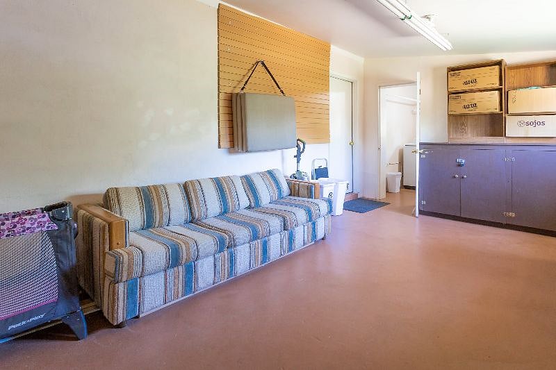 The garage area has a sofa for the dogs to sleep on if you choose to keep them in that room while you are out. There's also a large cooler, water cooler, folding camping chairs, a folding cot, sleeping pad and walking stick free to use.